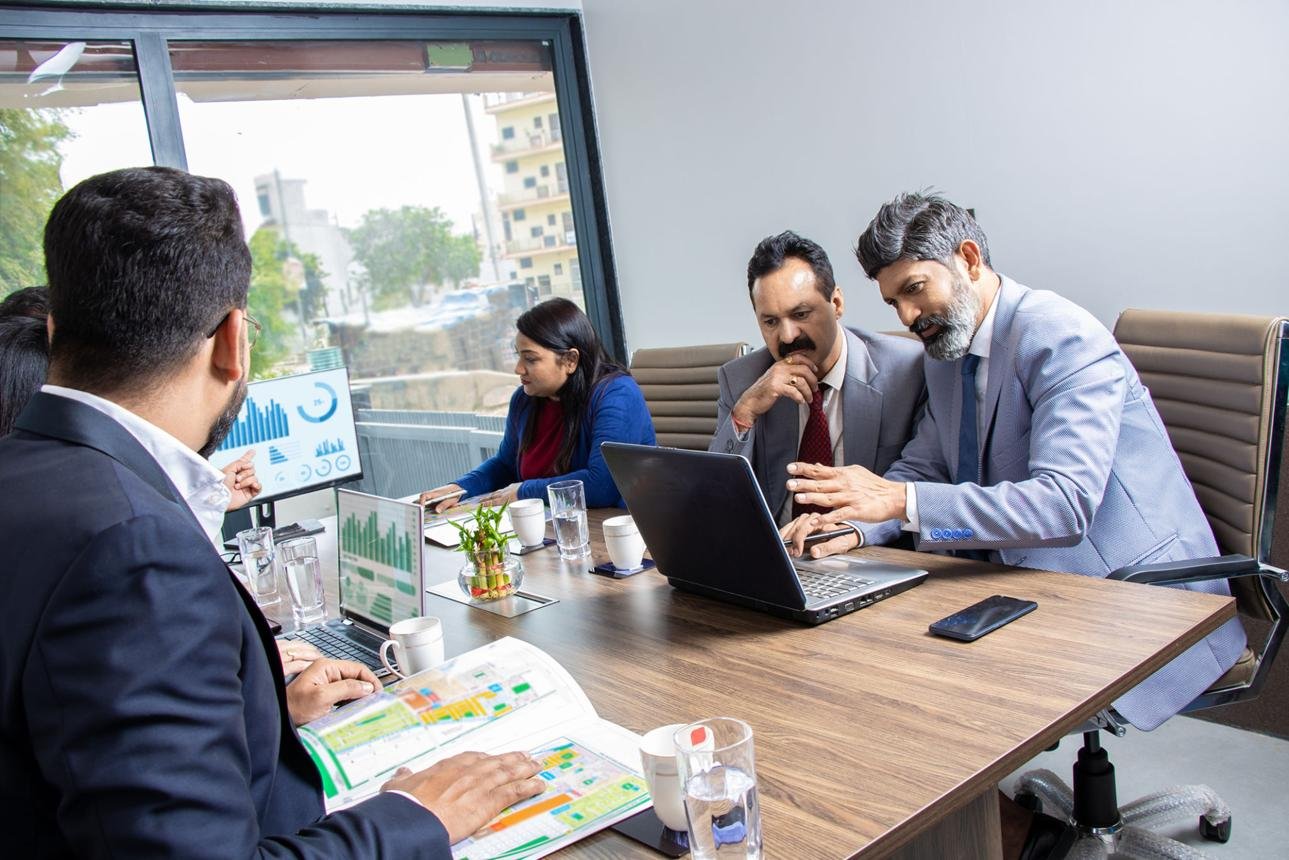 Godfather Consultancy advisors in a strategy session with a client