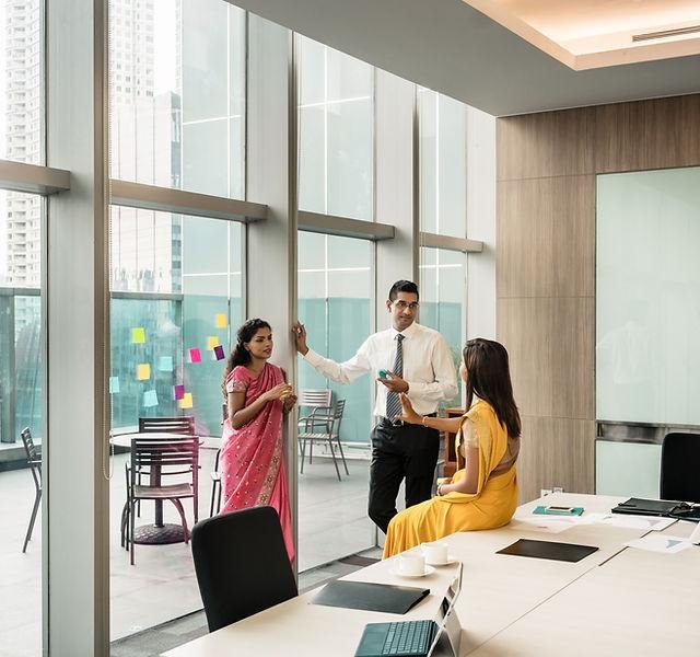 Consultants collaborating around a boardroom table